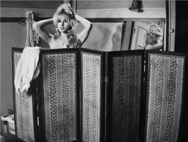 Brigitte Bardot behind a folding screen Bardot and the folding screen